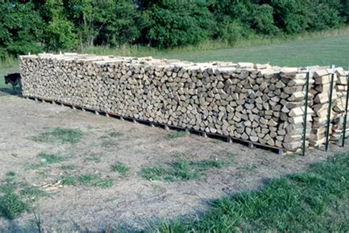 A real mixed outdoor stack of split firewood in LWN documentary context.